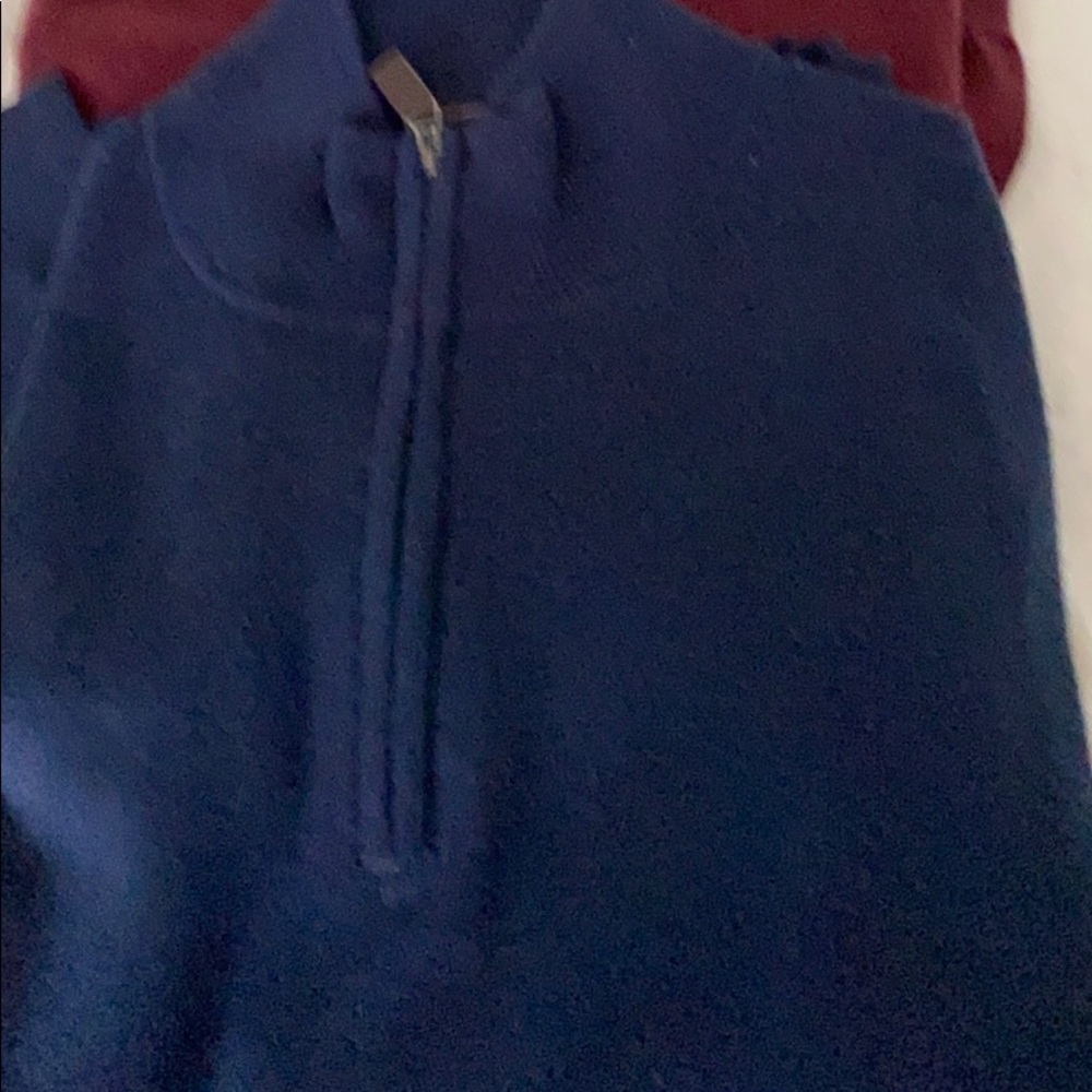 - Merino wool traveler quarter zip sweater